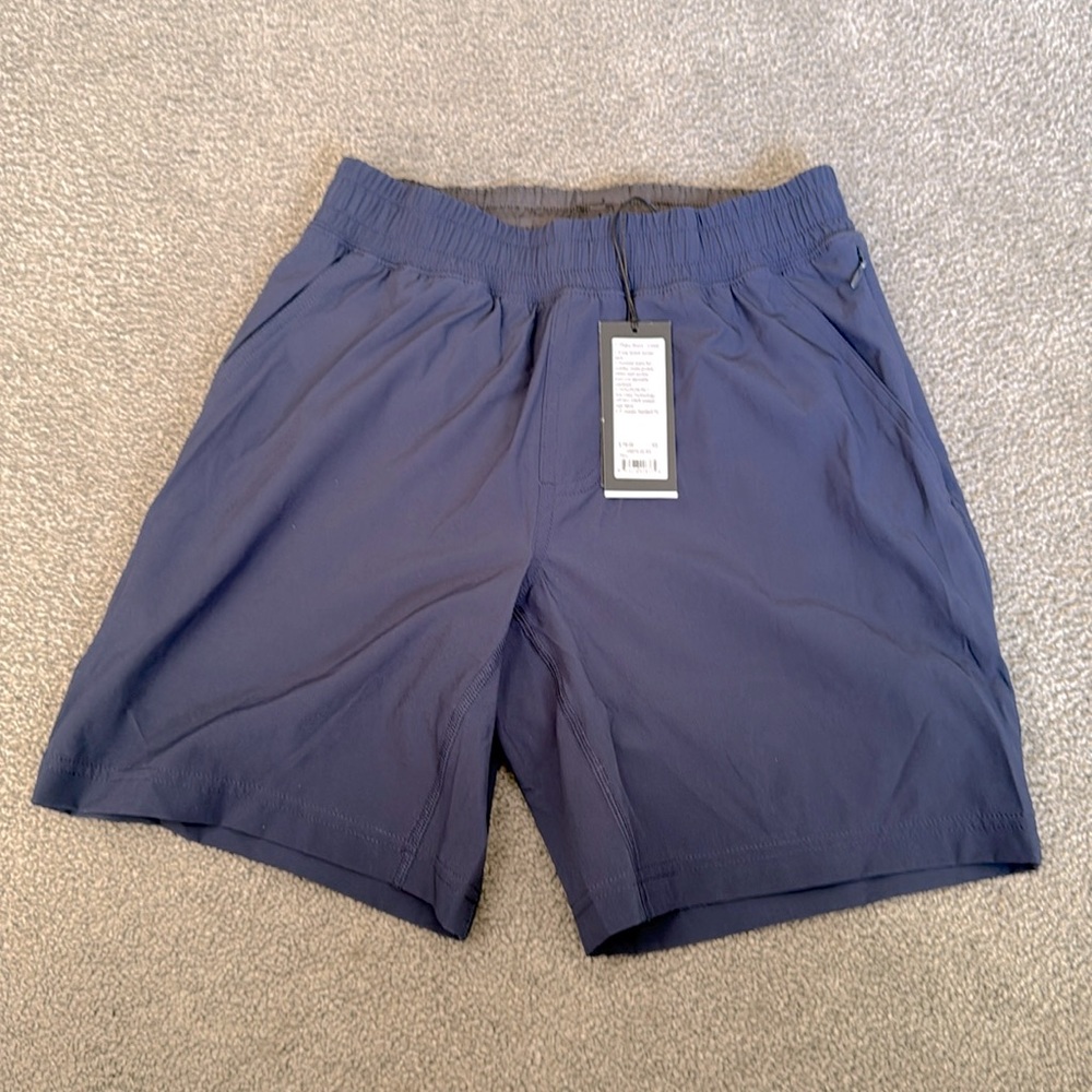 Rhone Maki XXX Men's Blue LINED Shorts. Zip side pocket. 7” inseam. Size XS